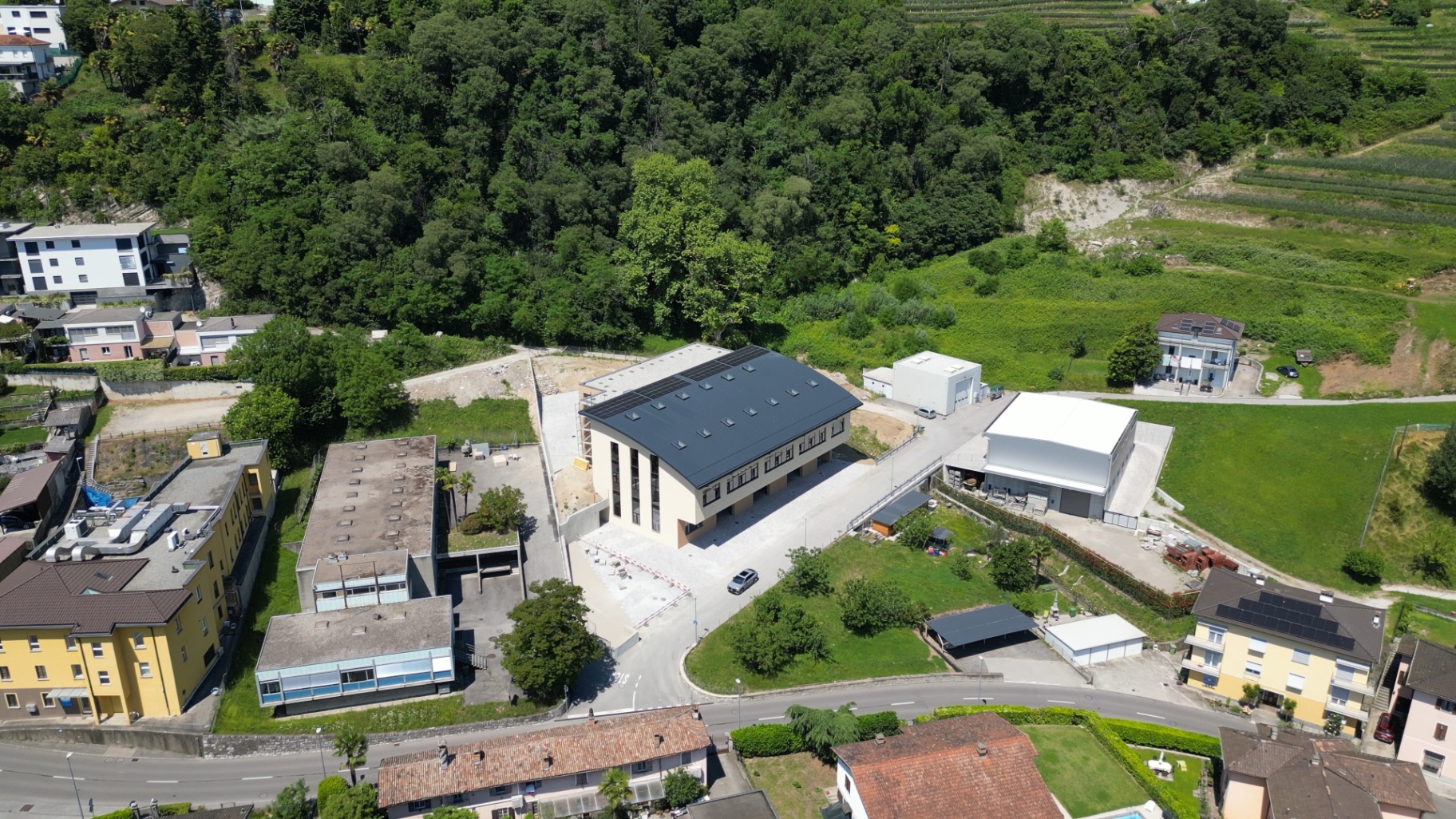 Wide aerial view: strategic location and built context