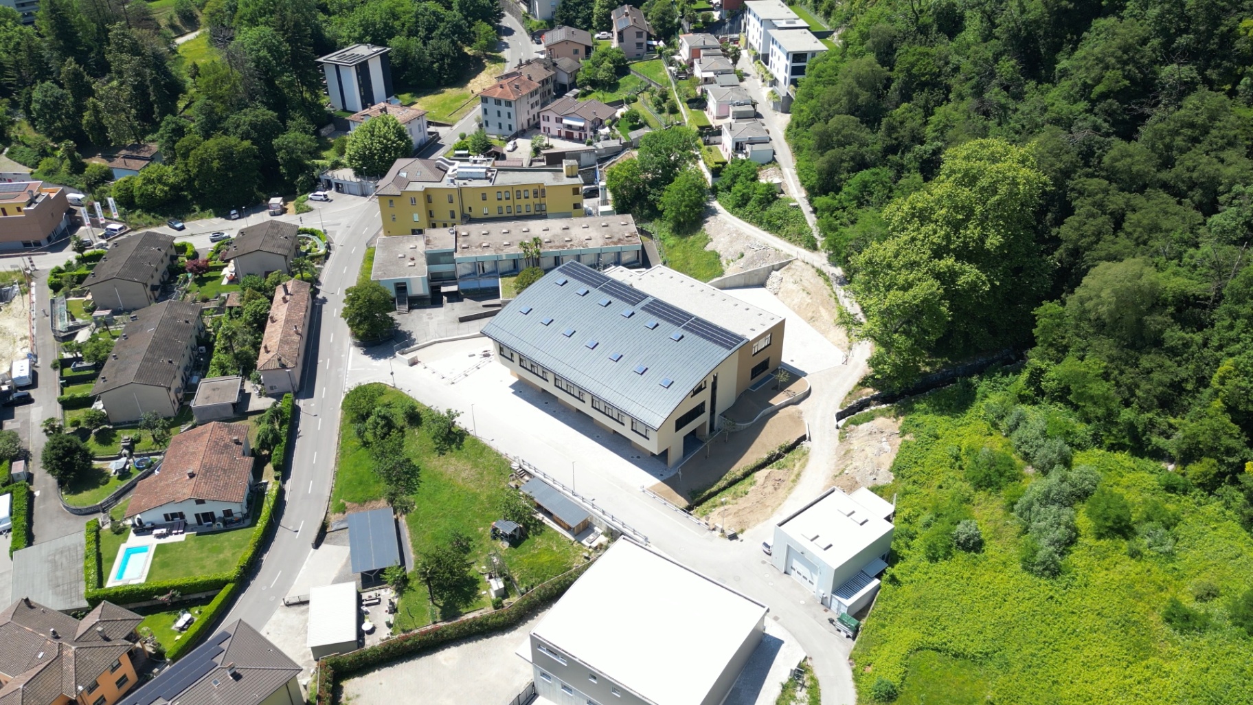 Aerial view of the site with parking and access