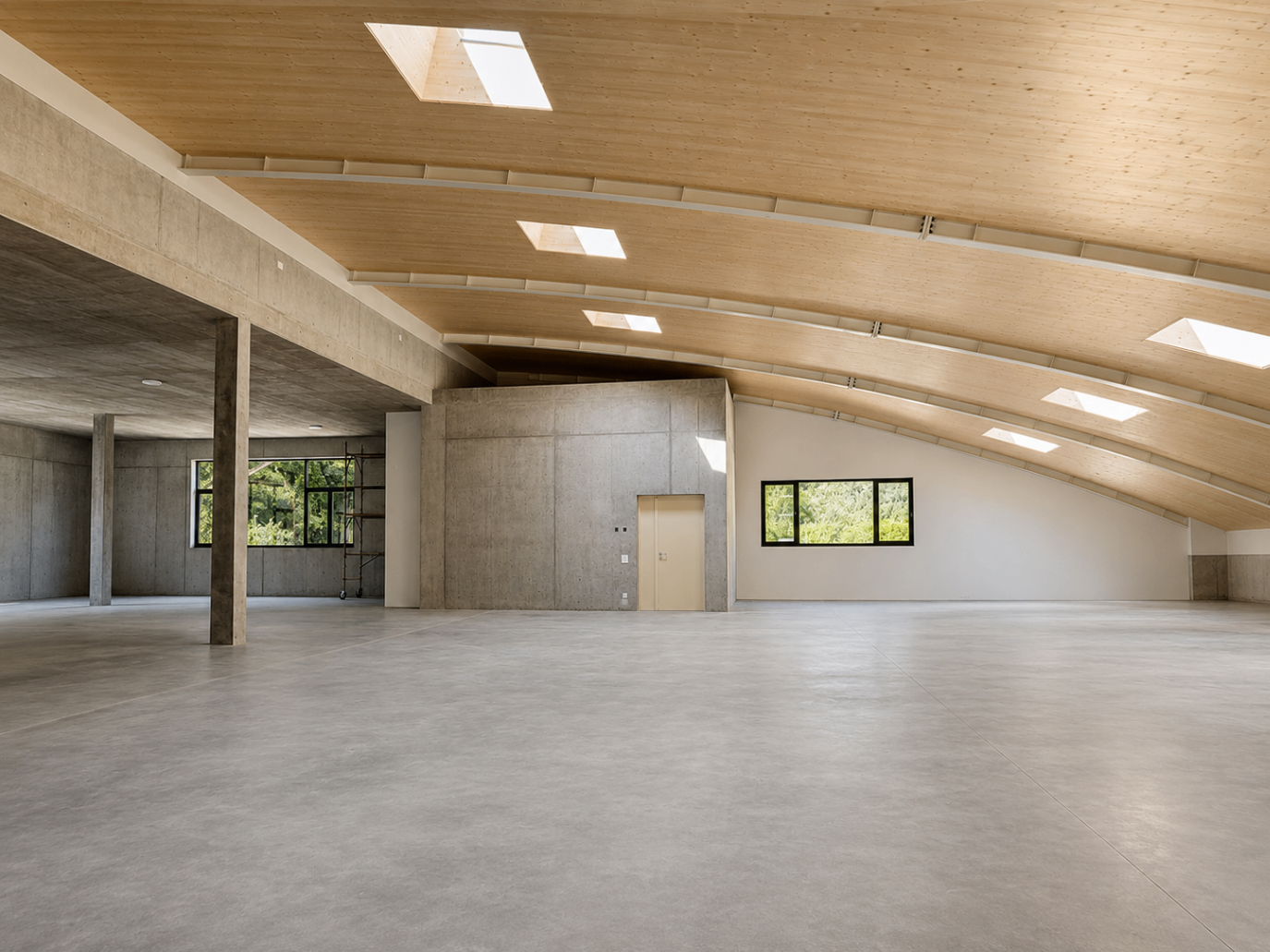 Open-plan interior with concrete ceiling and curved timber structure